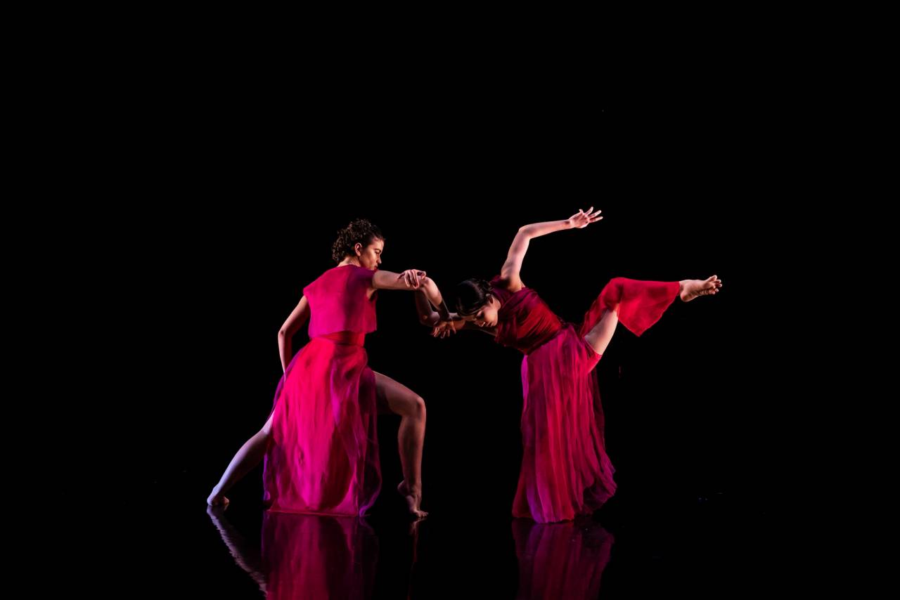 two dancers in red doing a powerful duet 