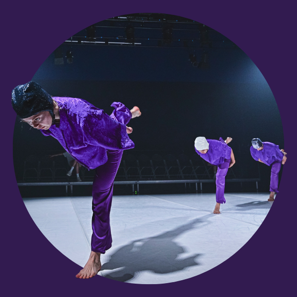 dancers in purple pyjama like costumes and glitter swim caps