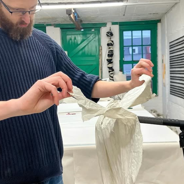 Richard tearing paper into a microphone in his studio