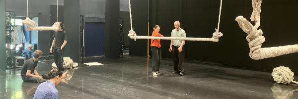 dancers in a studio with some paper sculptures 