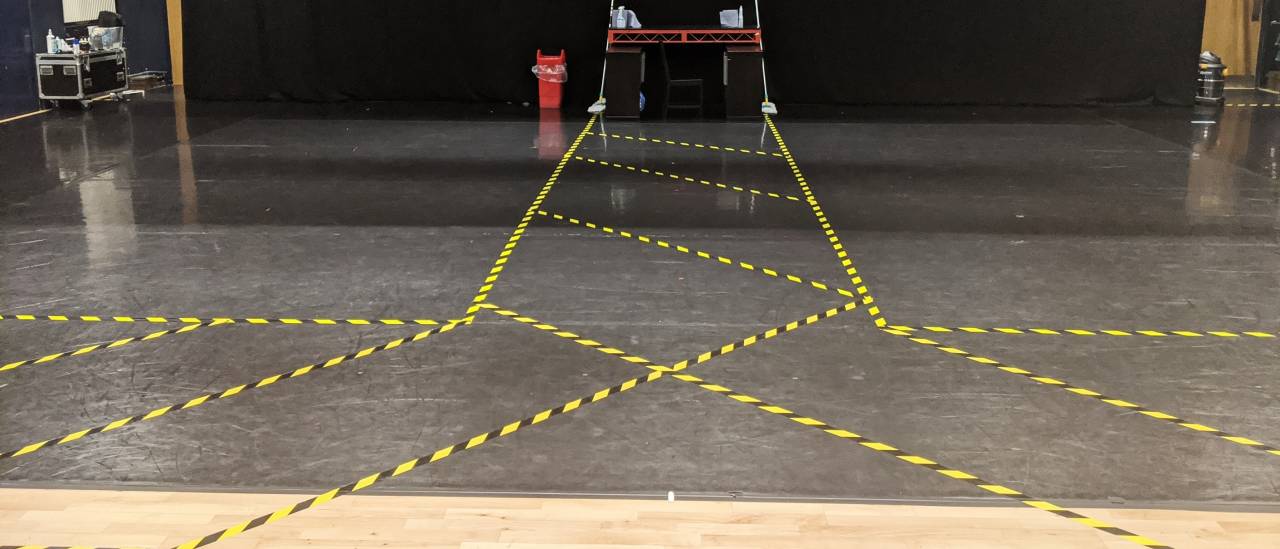 The large 'blue room' dance studio is taped into two separate dancing space using hazard tape