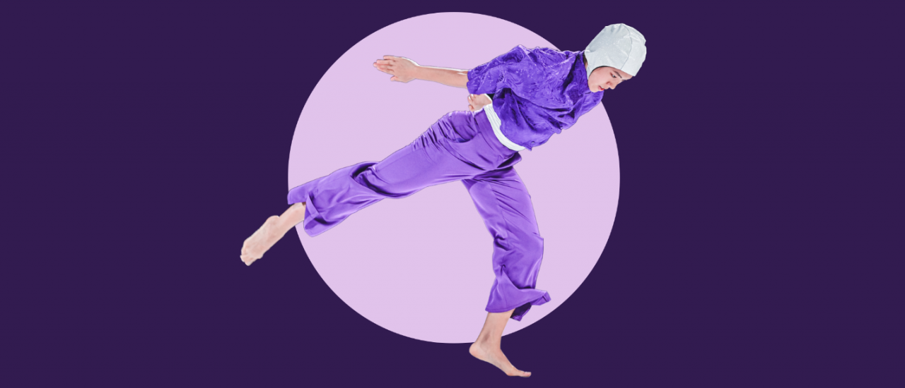 dancer in a purple satin pyjama like costume and a white glitter swim cap jumps across a purple graphic background