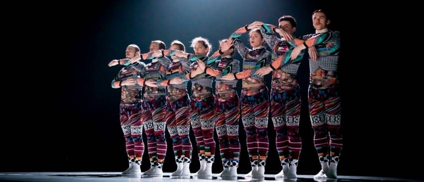 Tundra line of 8 dancers arms intertwined