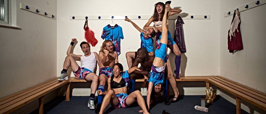 7 dancers screaming with joy, one standing upside down